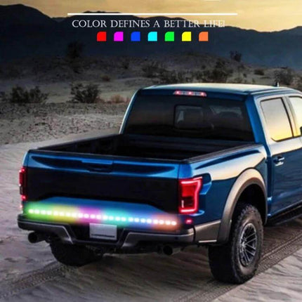 Car RGB LED Rear Light Strip For Safe Daytime Driving installed on pickup truck tailgate showing multicolor rear illumination for visibility and signaling