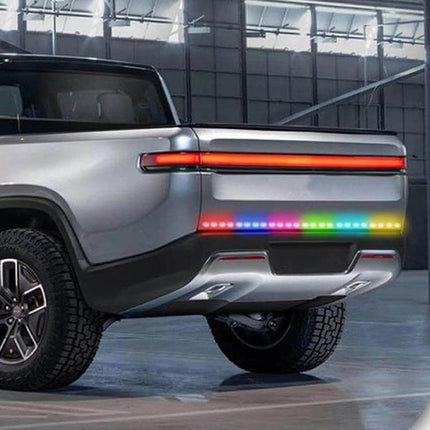 Car RGB LED Rear Light Strip For Safe Daytime Driving shown on pickup truck rear with multicolor RGB daytime visibility and signaling lights