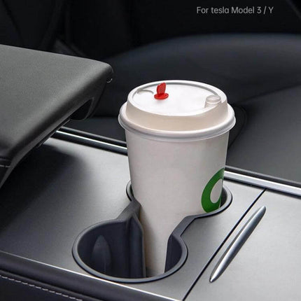 Shunwei Car Water Cup Holder for Tesla Model 3 and Y 2021-2022 installed in center console holding a takeaway coffee cup, secure and spill-resistant