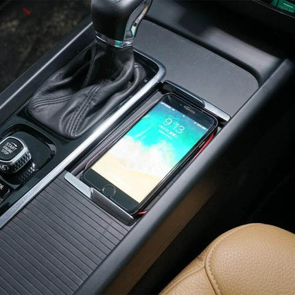 Car Wireless Charger For Volvo With Anti-Slip Design shown charging a smartphone securely in center console with anti-slip silicone pad