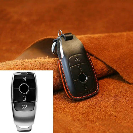 Cowhide Leather Key Protector for Mercedes-Benz Vehicles in black with red stitching, protects key from scratches and dirt, soft genuine cowhide grip