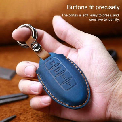 Protective Cowhide Leather Key Case for Nissan Qashqai Tiida blue leather key case held in hand with precise button cutouts and keyring