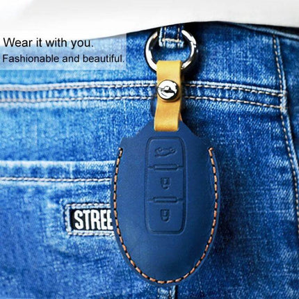 Protective Cowhide Leather Key Case for Nissan Qashqai Tiida shown hanging from jeans pocket, blue leather key cover with yellow strap