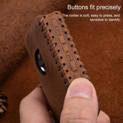 Soft Cowhide Leather Protective Key Case for Volvo Cars held in hand showing stitched brown leather and precise button fit