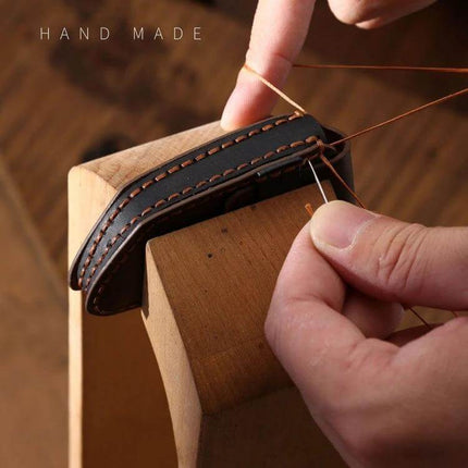 Leather Key Case in Cowhide for Land Rover Vehicles - handmade brown cowhide key case being hand-stitched to protect Range Rover and Discovery keys