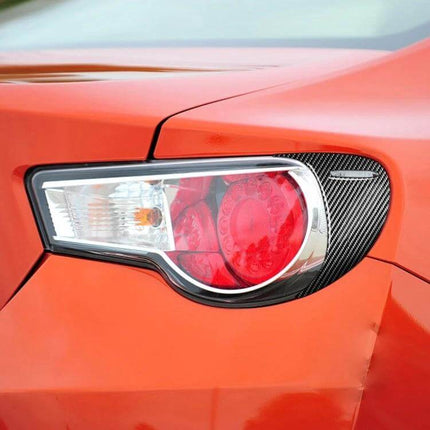 Carbon Fiber Decorative Stickers for Car Back Lamps, Set of Two applied to red car rear lamp for subtle carbon-fiber styling