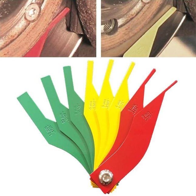 Car Brake Pad Thickness Ruler Portable Tool For Easy Checks showing colored plastic gauges fanned out and measuring brake pad wear