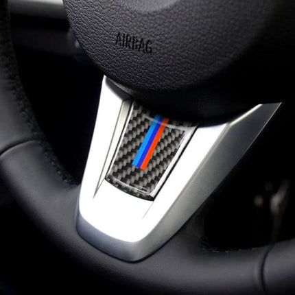 Carbon Fiber Decorative Steering Wheel Sticker for BMW Z4 Models installed on steering wheel center trim for subtle interior customization