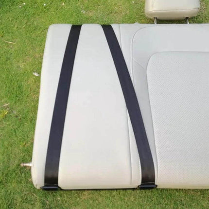 Universal ISOFIX Bracket for Child Safety Seat Installation in Cars installed on light car seat showing dual straps and anchors for secure transfer