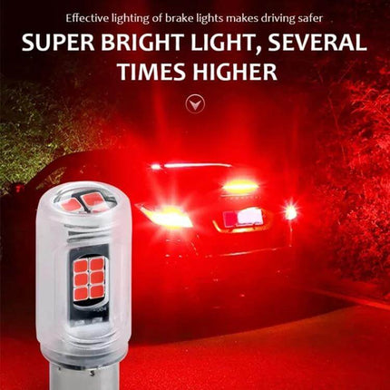 Two Pack Car LED Turn Signal Lights Red White Yellow - red LED bulb close-up with car brake lights glowing on dark road
