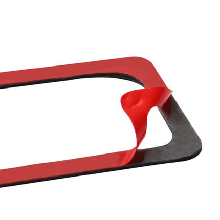 Set of 2 Carbon Fiber Door Lock Decorative Stickers for Nissan GTR R35 - close-up of black carbon fiber sticker with red adhesive backing peeled