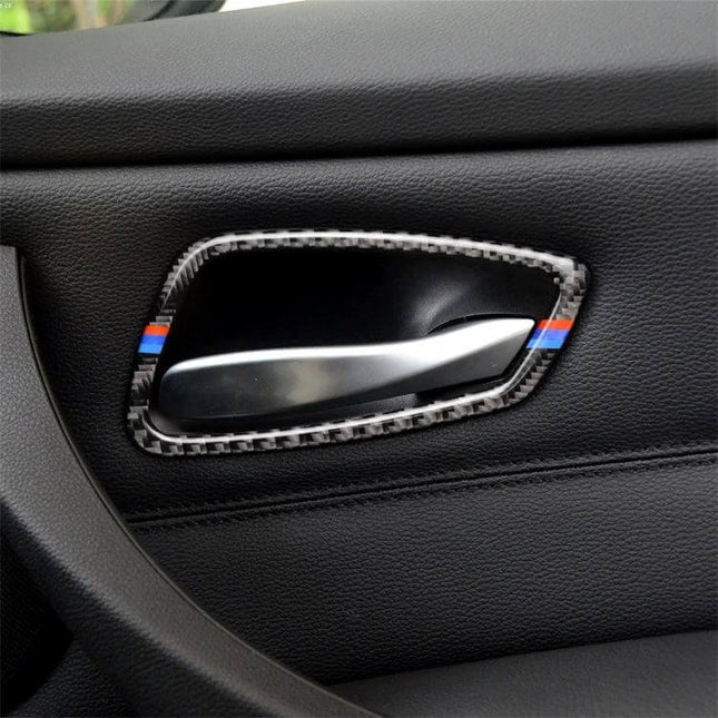 Carbon Fiber Three-Color Decorative Sticker for BMW Door Handles installed on black interior door handle with subtle blue-red stripe accents