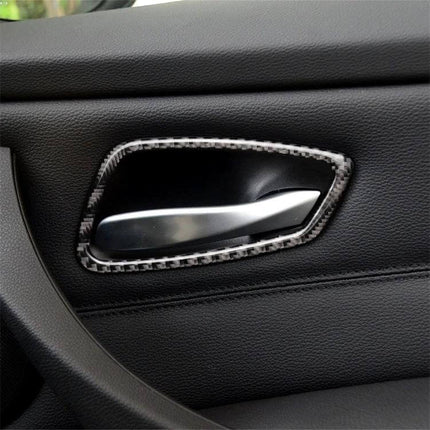 Carbon Fiber Decorative Sticker for BMW E90 Door Handles applied to interior door handle, black carbon fiber trim enhancing sporty look
