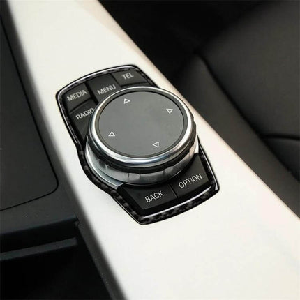 Carbon Fiber Multimedia Frame Sticker for BMW Vehicles applied to BMW iDrive controller showing carbon fiber trim and clean interior upgrade