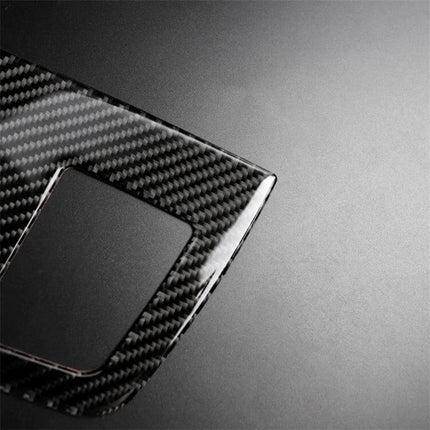Carbon Fiber Decorative Sticker for BMW Instrument Panels - close-up of glossy carbon fiber dashboard trim piece