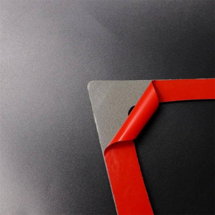 Carbon Fiber Decorative Sticker for BMW Instrument Panels — close-up of red-backed carbon fiber dashboard decal corner being peeled for easy application