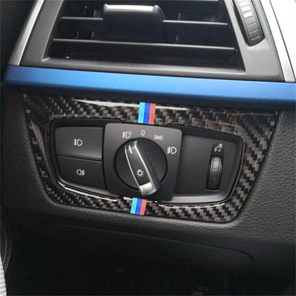 Three-Color Carbon Fiber Headlight Switch Sticker for BMW F30 and F34 installed on BMW F30 dashboard with tricolor stripe accent
