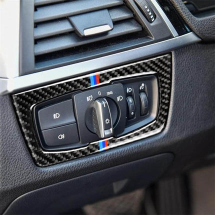 Three-Color Carbon Fiber Headlight Switch Sticker for BMW F30 and F34 installed on dashboard around headlight control with M-stripe accent