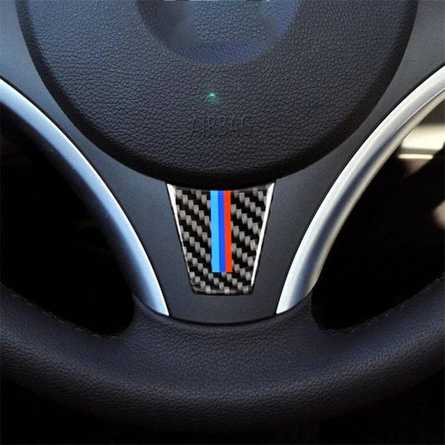 Carbon Fiber Decorative Sticker for BMW Steering Wheel in Three Colors — carbon fiber look with blue-red stripe applied to BMW steering wheel center