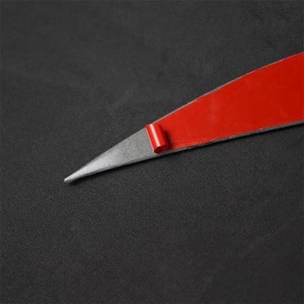 Carbon Fiber Decorative Sticker for Car Lamp Eyebrows in Yellow Red - close-up of red-backed carbon fiber eyebrow strip with peeling adhesive