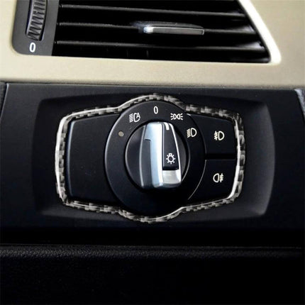 Carbon Fiber Decorative Sticker for BMW Headlight Switches applied to BMW dashboard headlight control for subtle interior upgrade