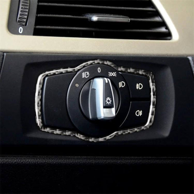 Carbon Fiber Decorative Sticker for BMW Headlight Switches applied to BMW dashboard headlight control for subtle interior upgrade