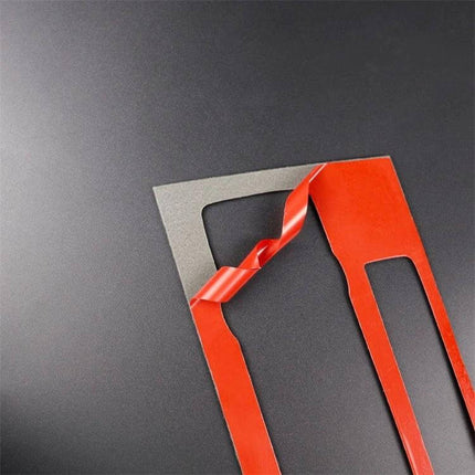 Carbon Fiber Decorative Sticker for BMW E90 E92 CD Panel - red backing film peeled showing adhesive trim for dashboard