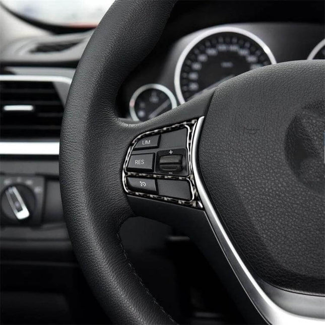 Carbon Fiber Decorative Sticker for BMW Steering Wheels applied to black BMW steering wheel buttons for subtle interior refresh