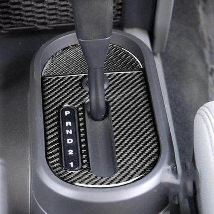 2 in 1 Carbon Fiber Gear Decorative Sticker for Jeep Wrangler JK 2007-2010 applied to center console gear shift area, black carbon fiber finish
