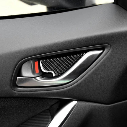 Universal Carbon Fiber Inner Door Bowl Sticker for Mazda Cars - close-up of carbon fiber inner door bowl decal on Mazda interior