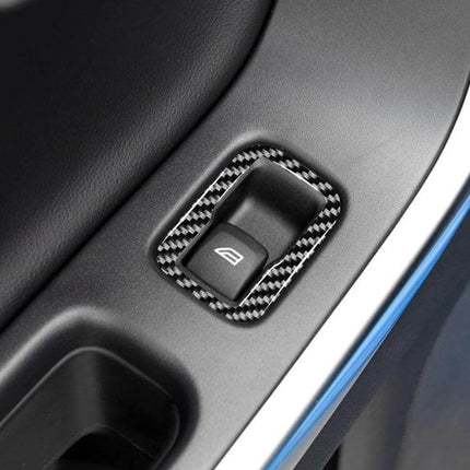 Carbon Fiber Decorative Stickers for Volvo V60 and S60, 3 Pack - close-up of carbon fiber window switch trim applied to interior door panel