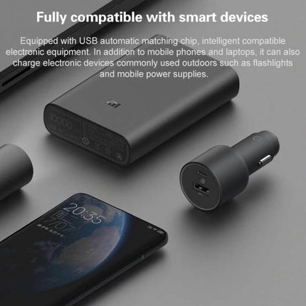 Xiaomi Car Charger With USB-C And USB-A Ports For On-The-Go Charging compact black dual-port car charger beside power bank and smartphone, 68W shared output