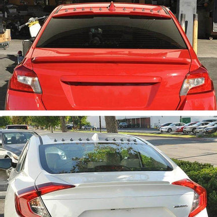 Universal EVO Style Shark Fin Car Roof Antenna Decoration mounted on red and white car roofs for sleek exterior upgrade
