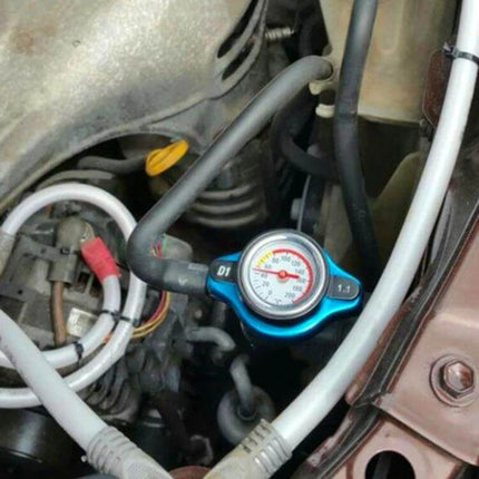 Car Water Tank Radiator Cover Accessory 0.9-1.3 Bar installed on engine with built-in temperature gauge and pressure dial for coolant regulation