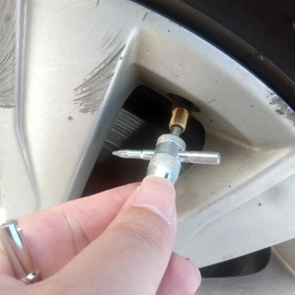 Handy Kit for Car Tire Maintenance During Daily Drives: close-up of user replacing valve core on car wheel with corrosion-resistant tool