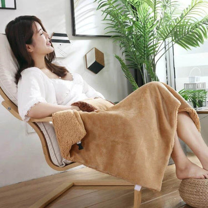 Electric Blanket With Hand Warmer Camel For Desk And Travel draped over woman in chair, showing plush flannel front and sherpa back, ideal for office or travel