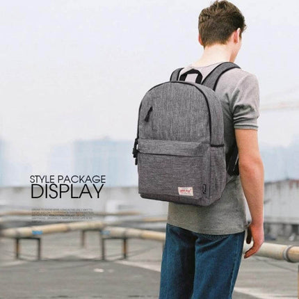 Canvas Laptop Bag And Backpack For 13.3 Inch Laptops on a commuter wearing grey canvas backpack with laptop compartment, durable and casual style