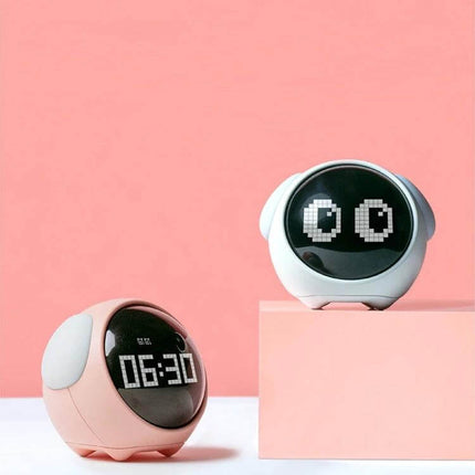Cartoon Cmart Alarm Clock For Kids With Night Light pink and white cute digital alarm clocks showing 06:30 and pixel eyes on pastel background