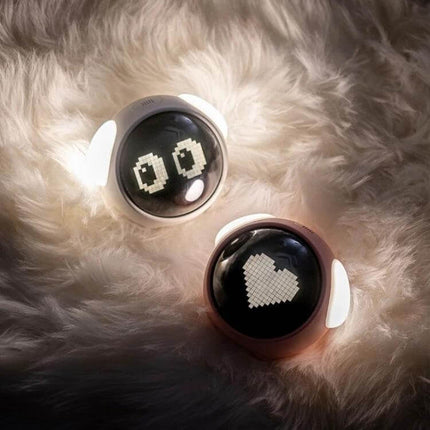Cartoon Cmart Alarm Clock For Kids With Night Light showing two round cartoon alarm clocks on a fluffy surface with warm 3000K night lights