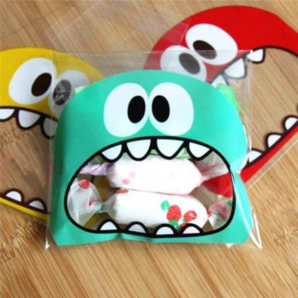 Cartoon Monster OPP Packaging Bags 7x7cm and 10x10cm – clear OPP snack bag with turquoise gravure-printed monster face showing candy inside