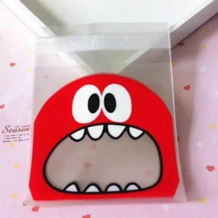 Cartoon Monster OPP Packaging Bags 7x7cm and 10x10cm red monster face clear OPP bag with gravure-printed cartoon design for snacks and party favors