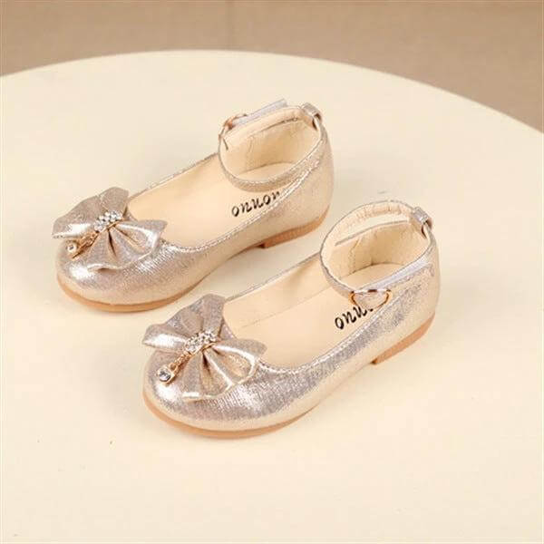 Girls Bow Shoes For Children With Size Guide 21 To 27 13 To 16 Cm - Shimmery gold PU dress shoes with bow and ankle strap for school or events