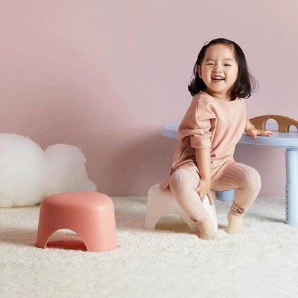 Children Stool Small Size For Everyday Home Use Simple Design - lightweight pink PP step stool with child sitting and smiling
