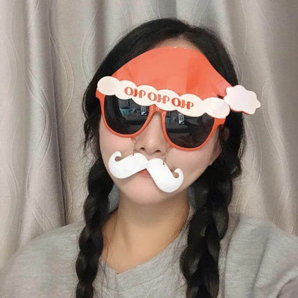 Christmas Hair Clip For Festive Everyday Wear Deer And Bell Design - plastic deer and bell holiday hair clip on model wearing festive sunglasses and mustache prop