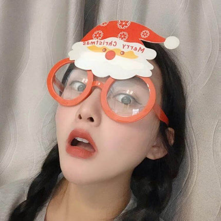 Christmas Hair Clip Personalized Holiday Accessory on cheerful woman wearing red Santa-themed plastic glasses hair clip for festive school or party looks