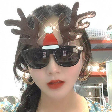 Christmas Hair Clip Personalized Holiday Accessory woman wearing reindeer antler clip with Santa hat sunglasses festive party look
