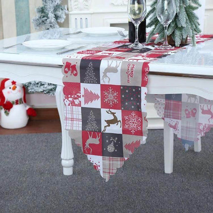 Christmas Table Runner 180 x 35 cm Flower Lattice Print red and grey patchwork runner on dining table with reindeer and snowflake motifs