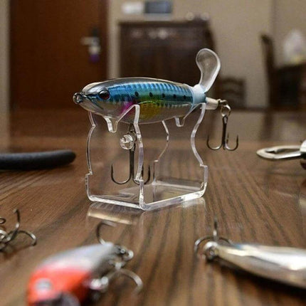 Fishing Lure Display Stands, 4-Pack For Tackle Shops Or Home - clear acrylic V-cutout stand showing blue crankbait on countertop