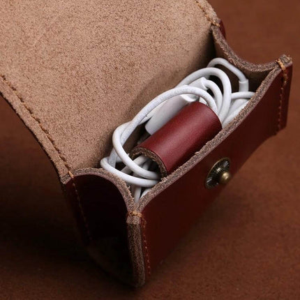 Earphones and Cable Storage Case, Portable Organizer small brown leather case holding coiled white earphones and cable protector