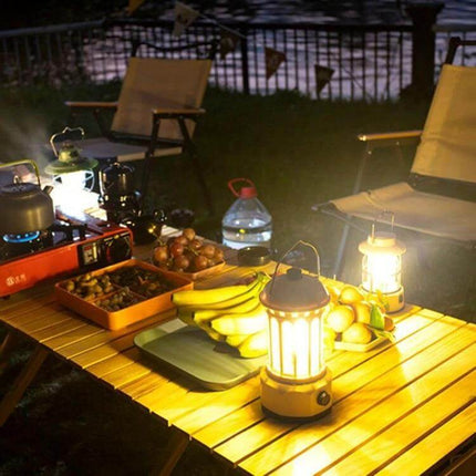 COB Battery Camping Lamp Small for Tents and Outdoors illuminating a picnic table with fruit and chairs at night
